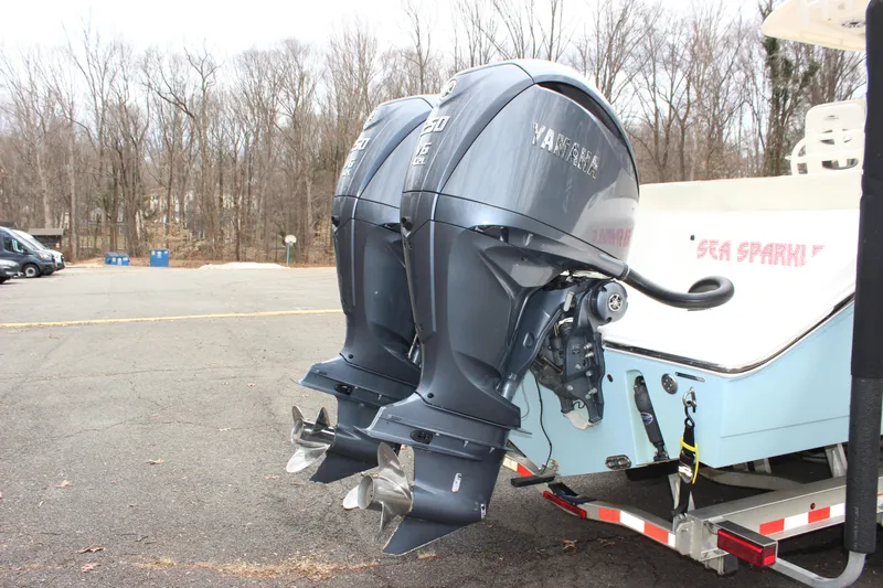  Yacht Photos Pics 2022 Cobia 280 Center Console with dual Yamaha outboard engines on a trailer.