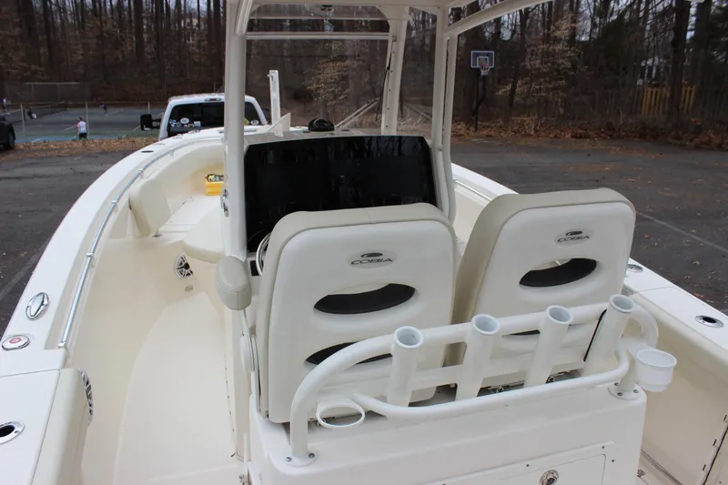  Yacht Photos Pics 2022 Cobia 280 Center Console boat interior with dual seats and rod holders.