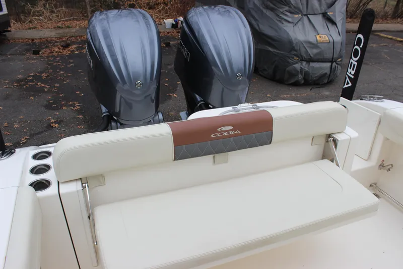  Yacht Photos Pics 2022 Cobia 280 Center Console boat with dual engines and cushioned seating.