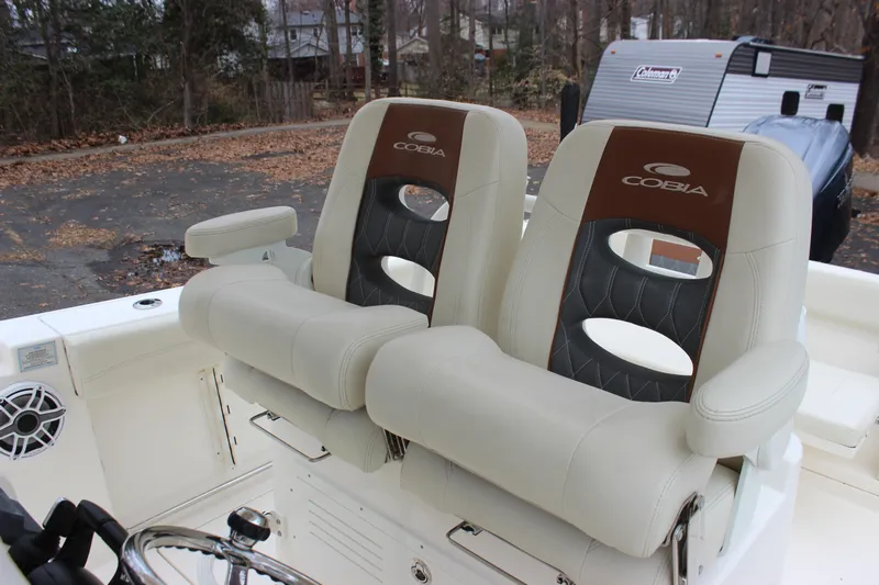  Yacht Photos Pics 2022 Cobia 280 Center Console boat seats, featuring dual cushioned chairs with armrests.