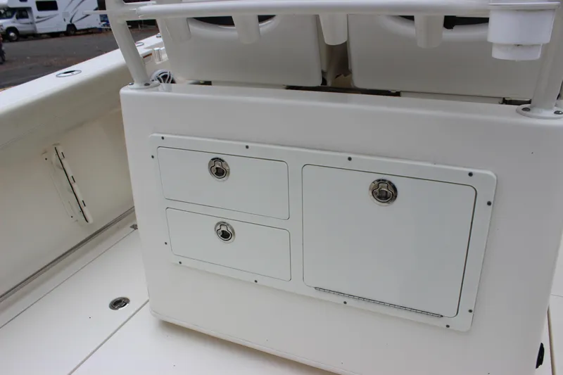  Yacht Photos Pics 2022 Cobia 280 Center Console boat storage compartments and seating area.