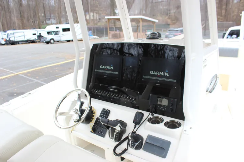  Yacht Photos Pics 2022 Cobia 280 Center Console boat dashboard with Garmin navigation system.