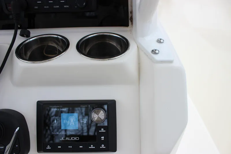  Yacht Photos Pics 2022 Cobia 280 Center Console dashboard with JL Audio system and cup holders.