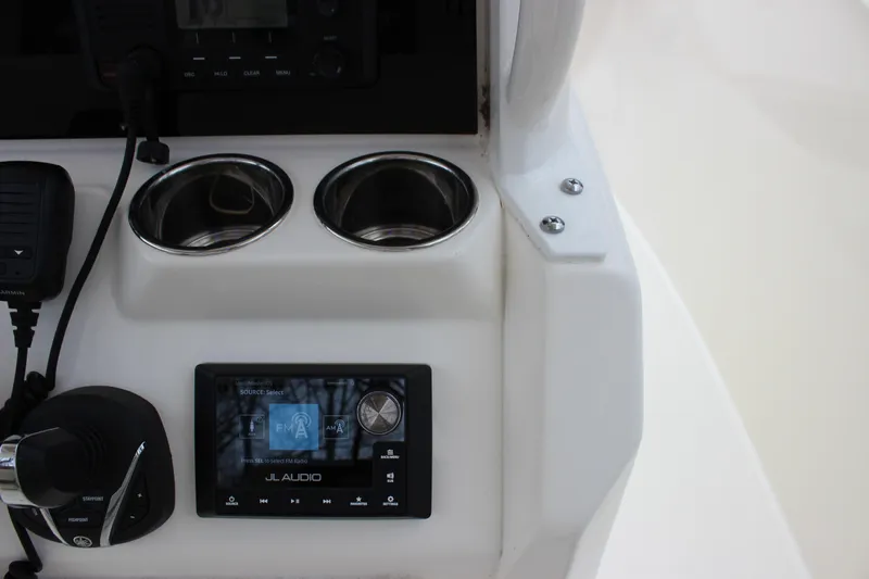  Yacht Photos Pics Center console of 2022 Cobia 280 with JL Audio system and cup holders.