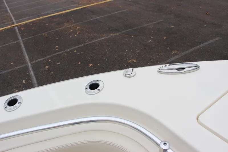  Yacht Photos Pics 2022 Cobia 280 Center Console boat deck with rod holders and cleat.