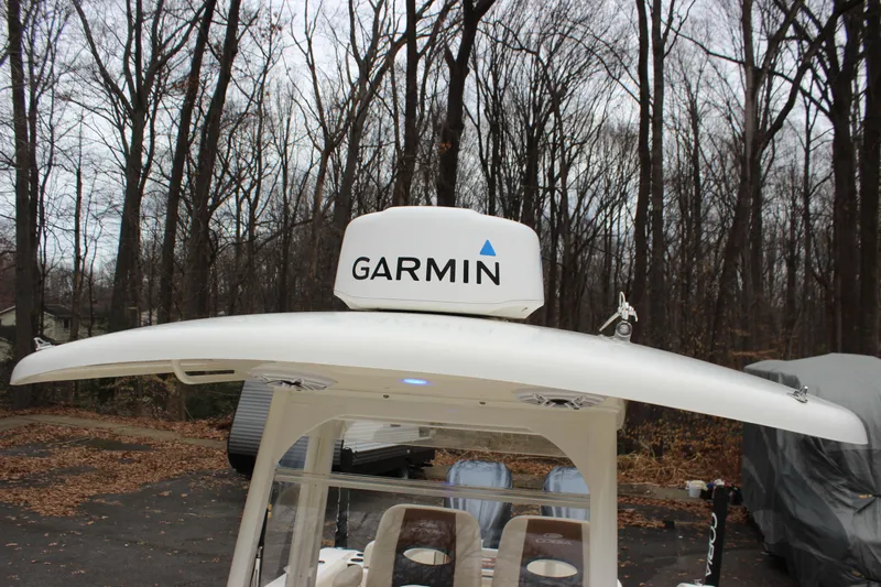  Yacht Photos Pics 2022 Cobia 280 Center Console with Garmin radar in wooded area.