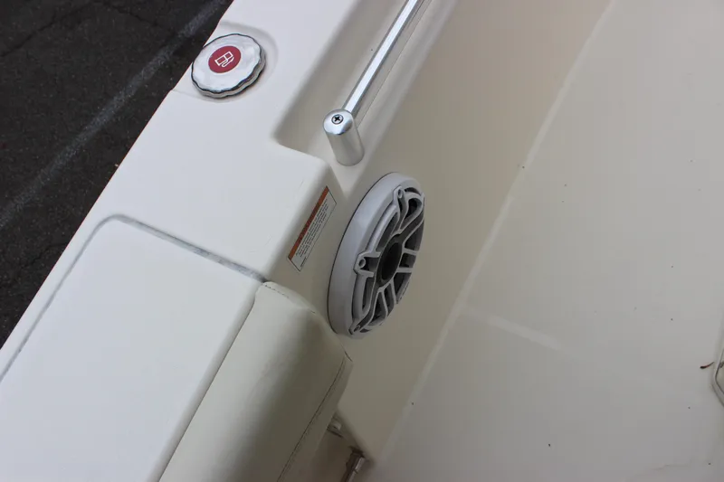  Yacht Photos Pics 2022 Cobia 280 Center Console boat interior with speaker and fuel cap.