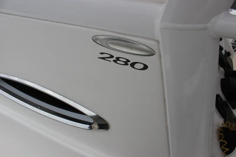  Yacht Photos Pics 2022 Cobia 280 Center Console boat detail with sleek design and chrome accents.