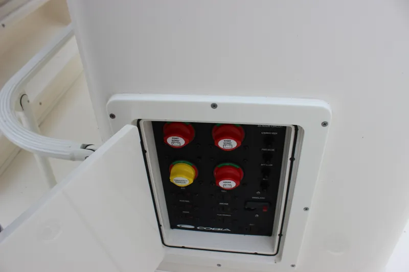  Yacht Photos Pics 2022 Cobia 280 Center Console electrical panel with labeled switches and controls.