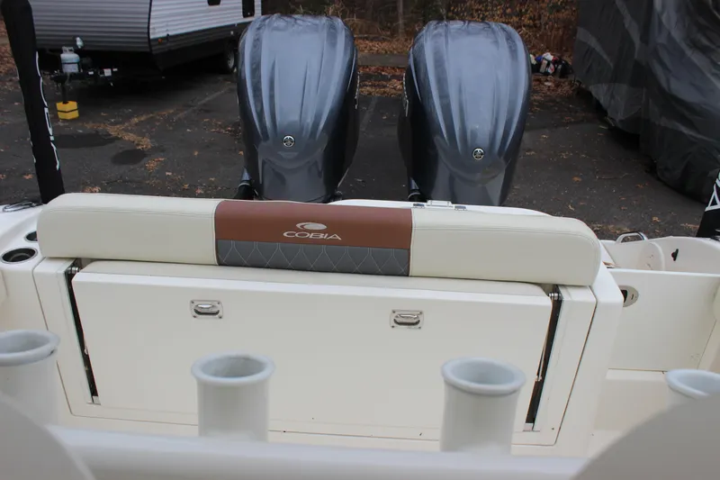  Yacht Photos Pics 2022 Cobia 280 Center Console boat with dual engines and rod holders.