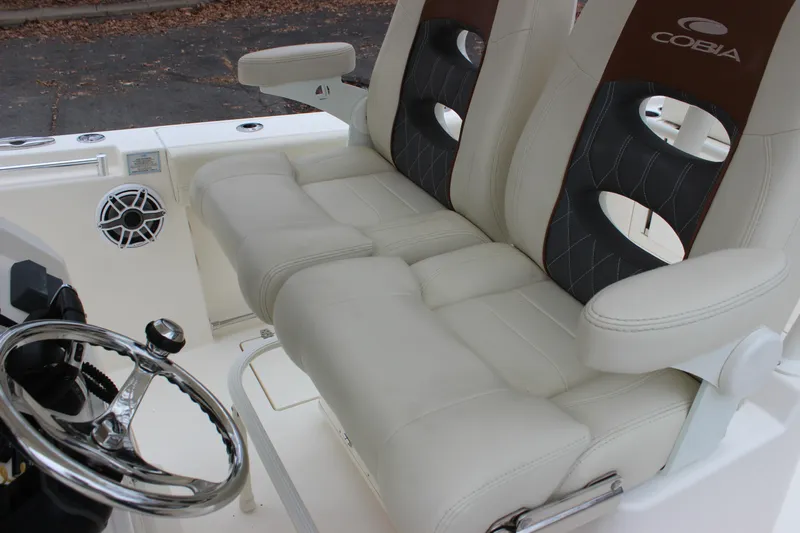  Yacht Photos Pics 2022 Cobia 280 Center Console boat interior with dual seats and steering wheel.
