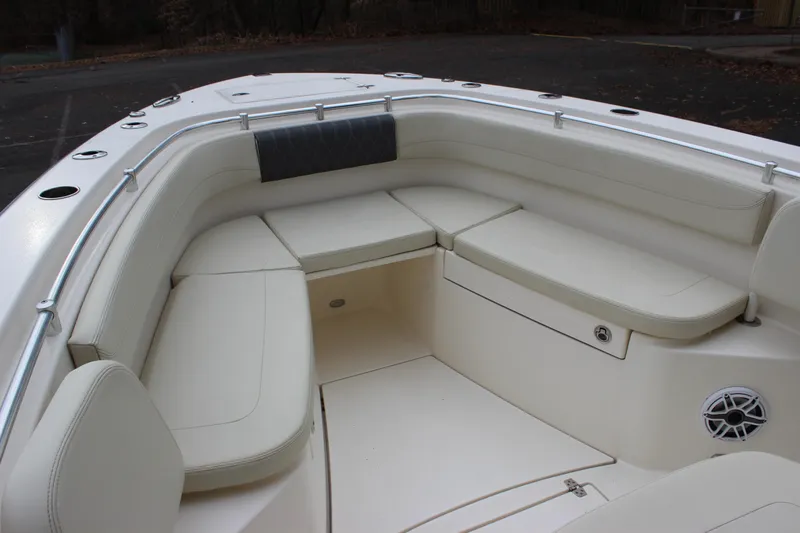  Yacht Photos Pics 2022 Cobia 280 Center Console boat with spacious seating area and sleek design.