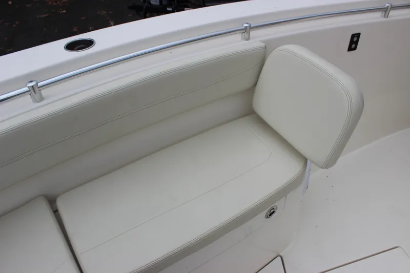  Yacht Photos Pics 2022 Cobia 280 Center Console boat with white cushioned seating.