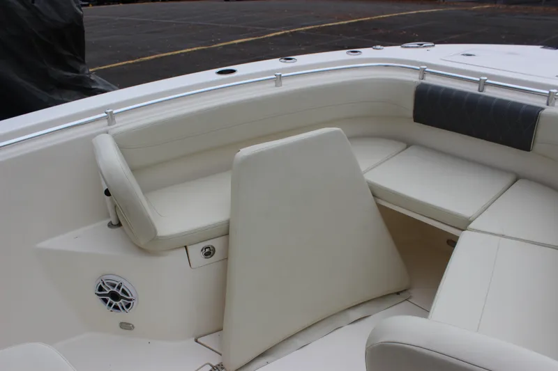  Yacht Photos Pics 2022 Cobia 280 Center Console boat interior with cushioned seating and speaker.