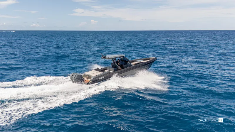 New 2025 Skipper 38 Twin Mercury 400 - Sunbed Ed Yacht Photos Pics 2025 Skipper-BSK 38NC boat cruising on open sea under clear skies.