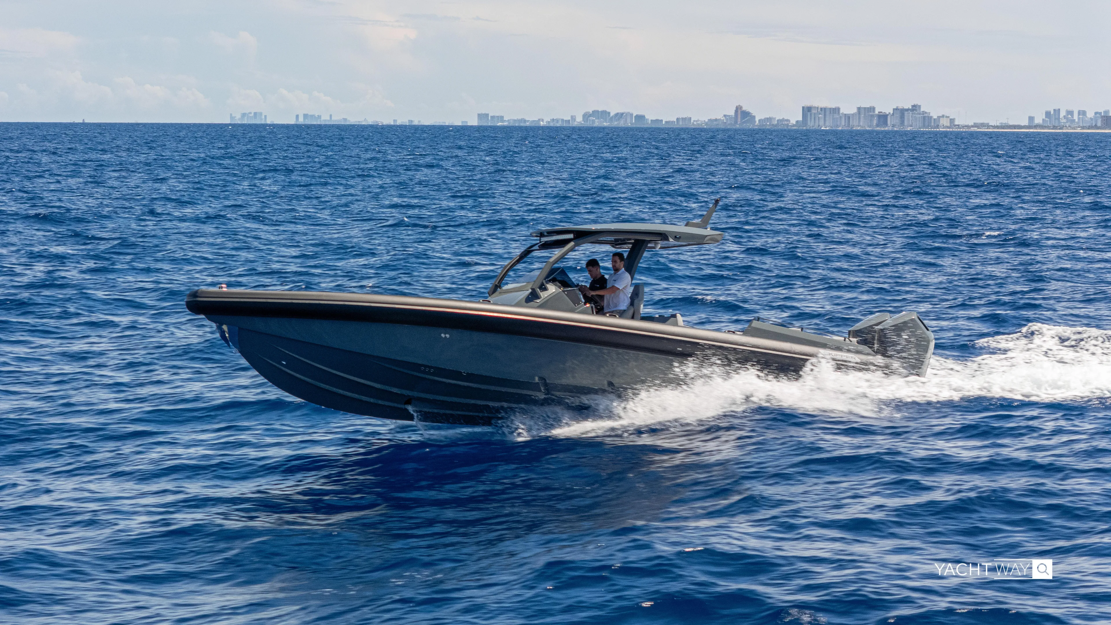 New 2025 Skipper 38 Twin Mercury 400 - Sunbed Ed Yacht Photos Pics 2025 Skipper-BSK 38NC boat cruising on open sea with city skyline in background.