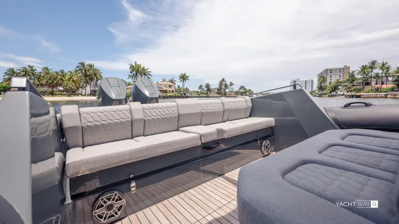 New 2025 Skipper 38 Twin Mercury 400 - Sunbed Ed Yacht Photos Pics Luxurious seating on 2025 Skipper-BSK 38NC yacht, with scenic waterfront view.