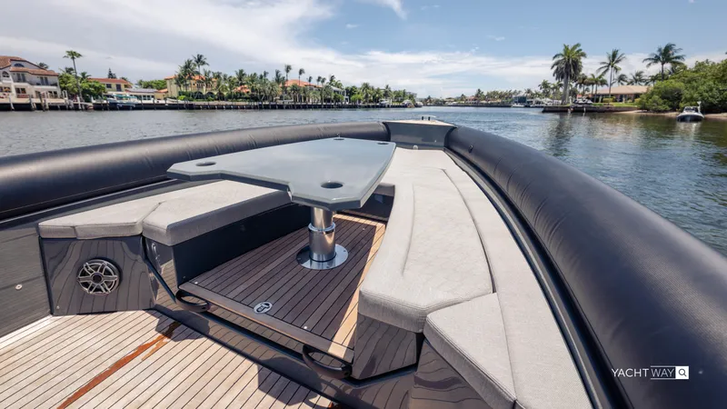 New 2025 Skipper 38 Twin Mercury 400 - Sunbed Ed Yacht Photos Pics Luxurious 2025 Skipper-BSK 38NC yacht with spacious seating and table on a scenic waterway.