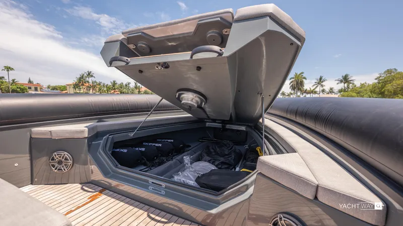 New 2025 Skipper 38 Twin Mercury 400 - Sunbed Ed Yacht Photos Pics Open storage compartment on 2025 Skipper-BSK 38NC boat, showcasing spacious interior and sleek design.