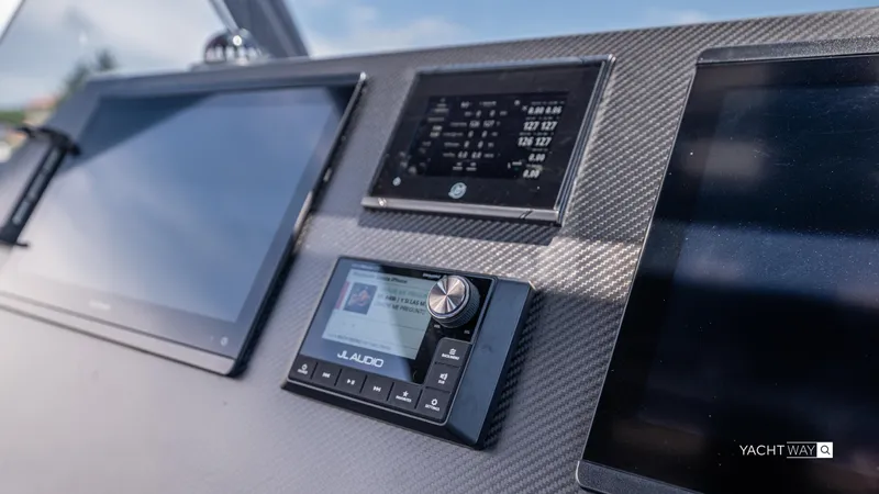 New 2025 Skipper 38 Twin Mercury 400 - Sunbed Ed Yacht Photos Pics Dashboard of 2025 Skipper-BSK 38NC yacht with JL Audio system and digital displays.