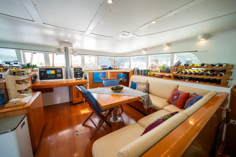  Yacht Photos Pics Interior of 2007 Lagoon 500 yacht with cozy seating and vibrant decor.