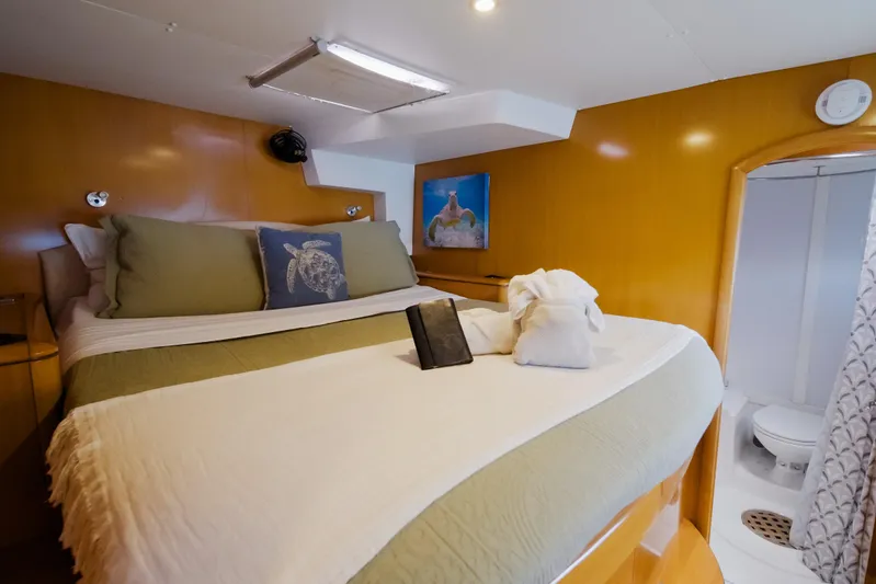  Yacht Photos Pics Luxurious cabin interior of 2007 Lagoon 500 yacht with cozy bed and ensuite bathroom.