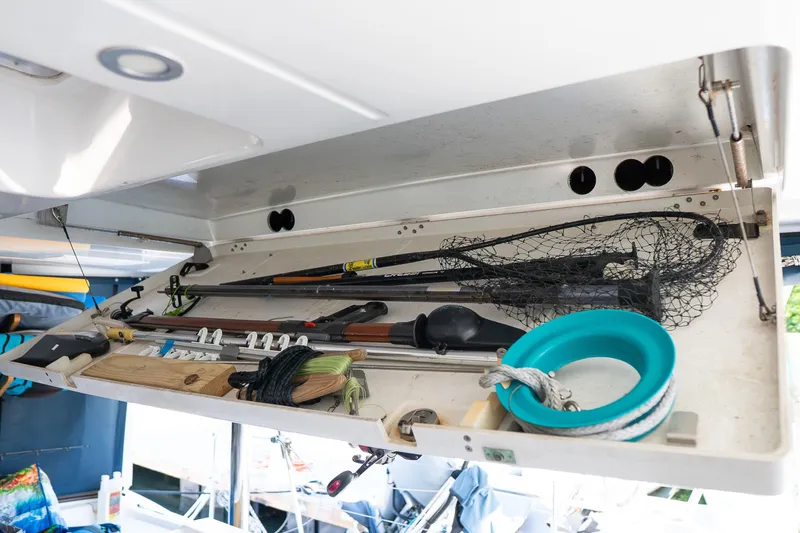  Yacht Photos Pics Storage compartment on a 2007 Lagoon 500 yacht with fishing gear and equipment.