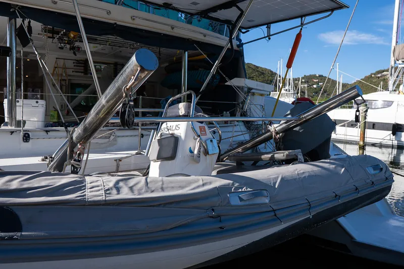  Yacht Photos Pics Inflatable boat docked beside a 2007 Lagoon 500 yacht in a marina.