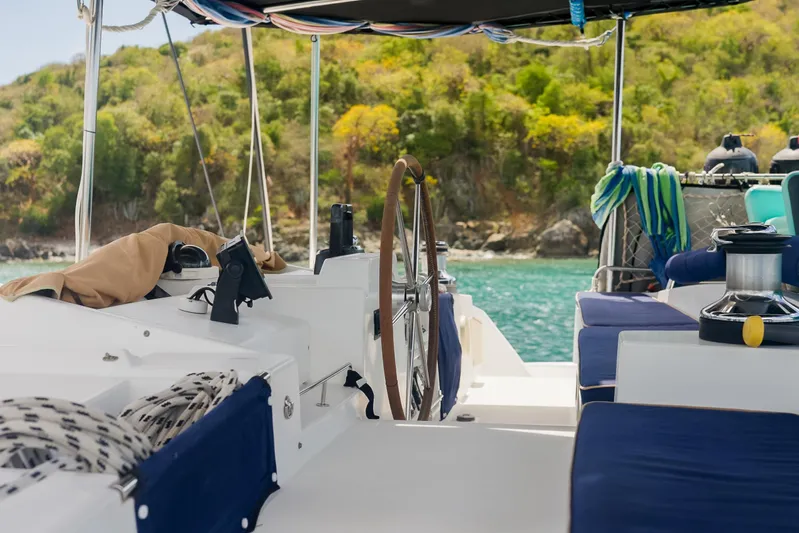  Yacht Photos Pics Interior view of a 2007 Lagoon 500 catamaran with scenic coastal backdrop.