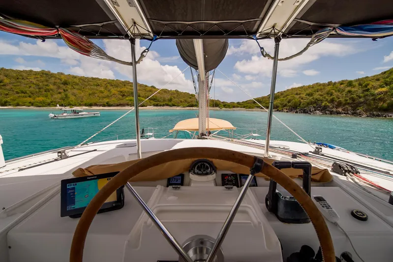  Yacht Photos Pics Cockpit view from a 2007 Lagoon 500 catamaran sailing in turquoise waters.