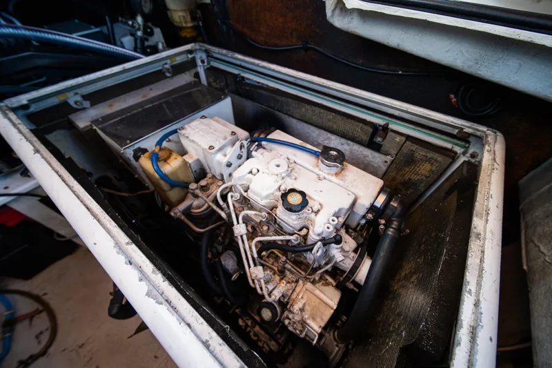  Yacht Photos Pics Engine compartment of a 2007 Lagoon 500 catamaran, showcasing mechanical components.