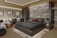 Luxurious modern bedroom with stone accent wall, elegant furnishings, and ambient lighting, Project Raptor 2028.