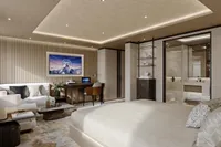 Luxurious modern bedroom with elegant decor, featuring a cozy seating area and stylish workspace, Project Raptor 2028.