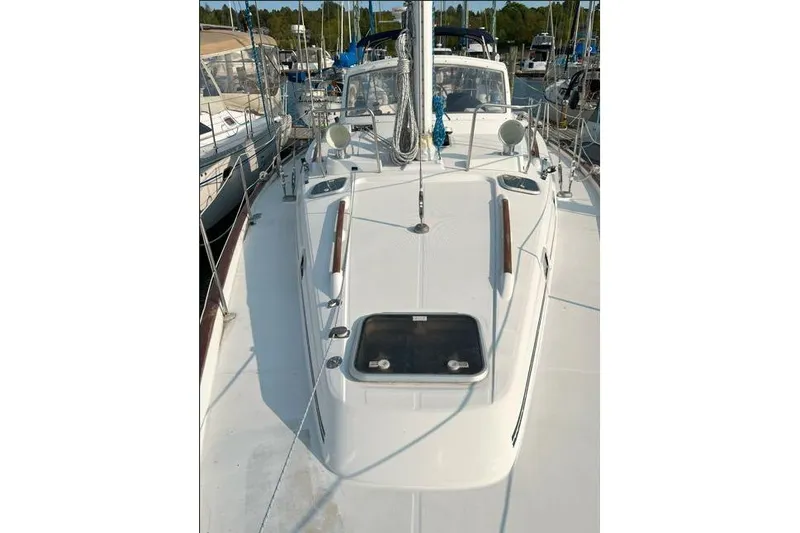  Yacht Photos Pics 1995 Beneteau Oceanis 44 CC sailboat deck view at marina.