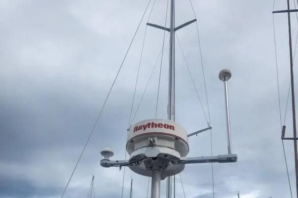  Yacht Photos Pics Radar equipment on a 1995 Beneteau Oceanis 44 CC sailboat under cloudy skies.