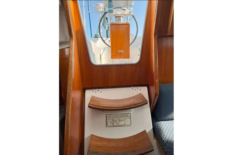  Yacht Photos Pics Interior view of 1995 Beneteau Oceanis 44 CC sailboat with wooden steps and seating.