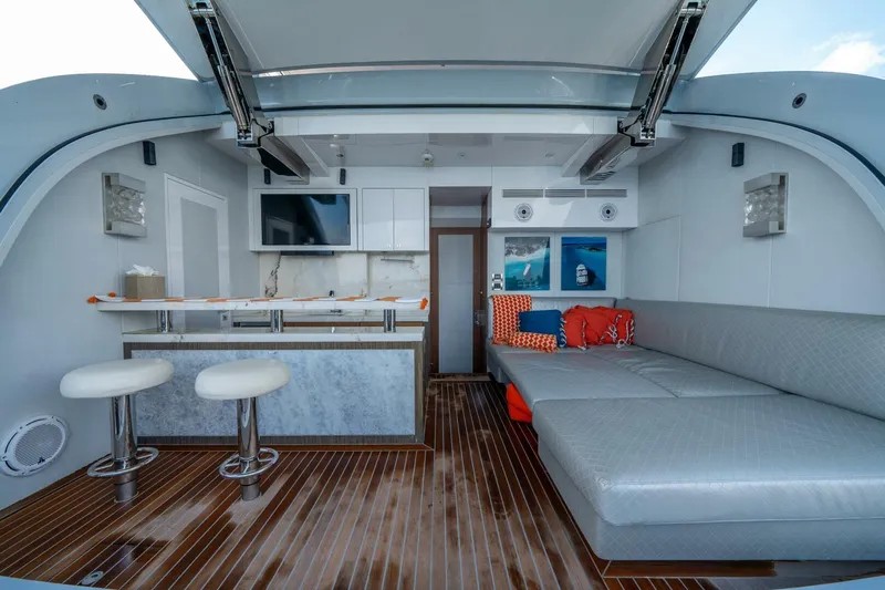 Day One Yacht Photos Pics Luxurious interior of 2020 Hargrave C92 yacht with modern seating and bar area.