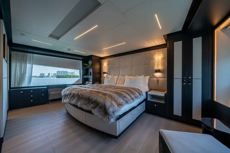 Day One Yacht Photos Pics Luxurious bedroom interior on 2020 Hargrave C92 yacht with waterfront view.