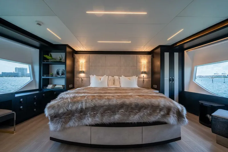 Day One Yacht Photos Pics Luxurious bedroom interior on 2020 Hargrave C92 yacht with waterfront views and elegant decor.