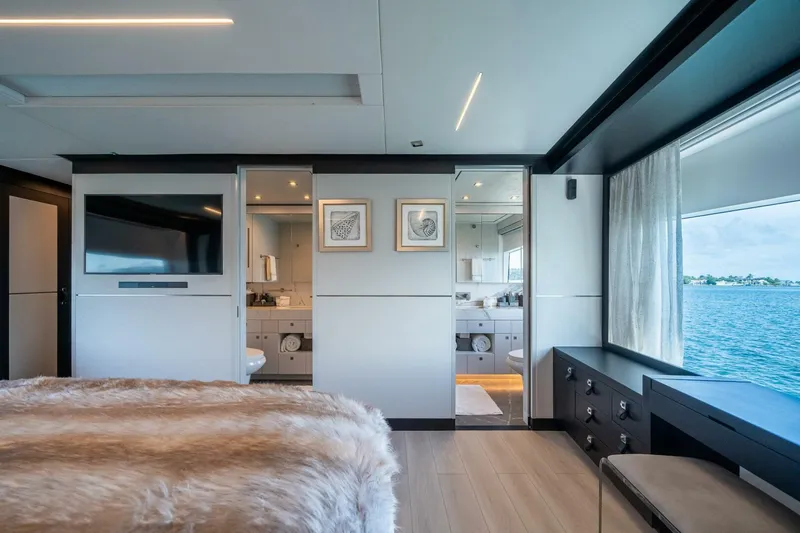 Day One Yacht Photos Pics Luxurious Hargrave C92 yacht bedroom with ocean view, modern decor, and ensuite bathroom, 2020 model.