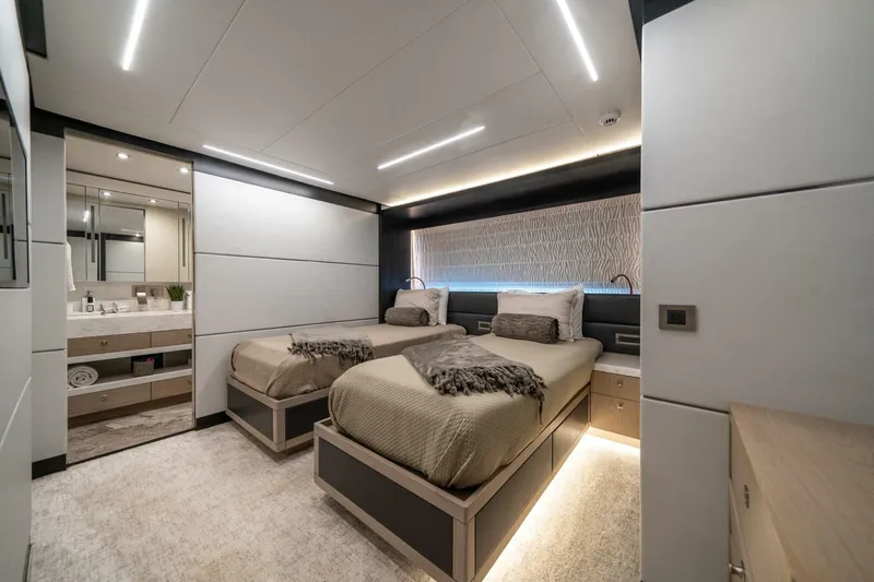 Day One Yacht Photos Pics Luxurious 2020 Hargrave C92 yacht bedroom with twin beds and modern decor.