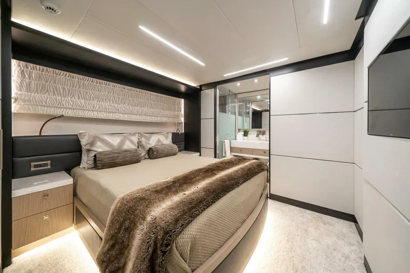 Day One Yacht Photos Pics Luxurious bedroom interior of 2020 Hargrave C92 yacht with modern design and elegant furnishings.