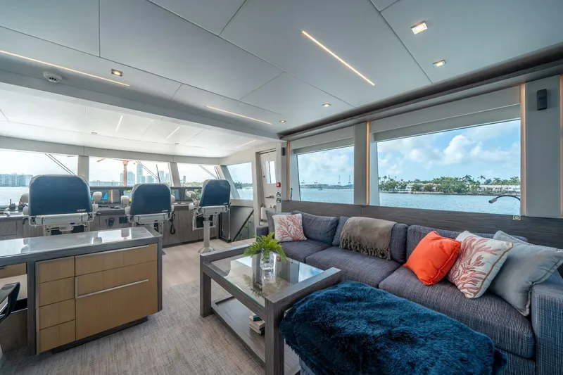 Day One Yacht Photos Pics Luxurious interior of 2020 Hargrave C92 yacht with modern seating and scenic ocean views.