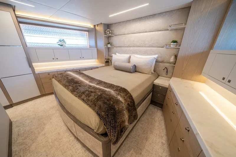 Day One Yacht Photos Pics Luxurious bedroom interior of 2020 Hargrave C92 yacht with modern design and elegant furnishings.