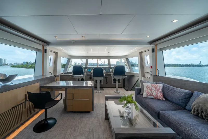 Day One Yacht Photos Pics Luxurious interior of 2020 Hargrave C92 yacht with modern furnishings and panoramic windows.