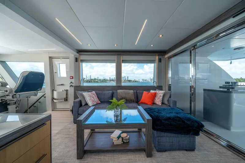 Day One Yacht Photos Pics Luxurious interior of 2020 Hargrave C92 yacht with modern furnishings and panoramic windows.