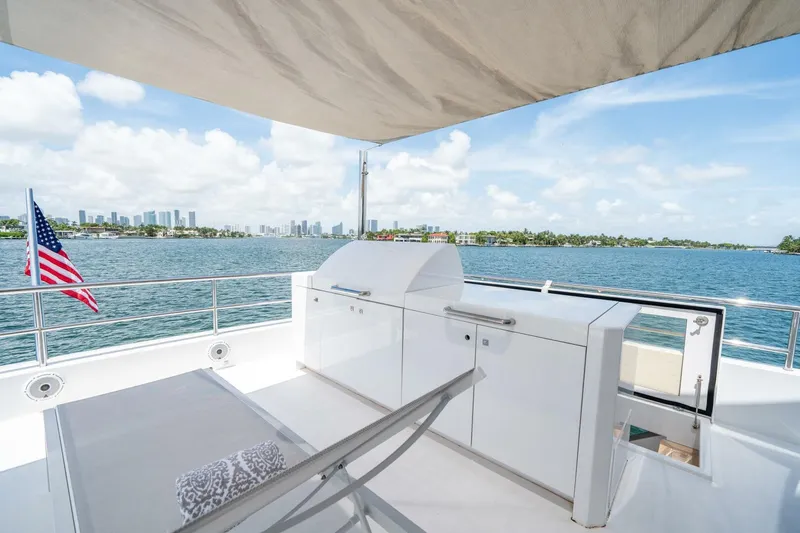 Day One Yacht Photos Pics Luxurious 2020 Hargrave C92 yacht deck with stunning waterfront city view.