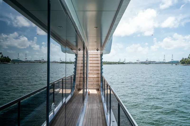 Day One Yacht Photos Pics Luxurious Hargrave C92 yacht deck with ocean view, 2020 model, reflecting modern elegance.
