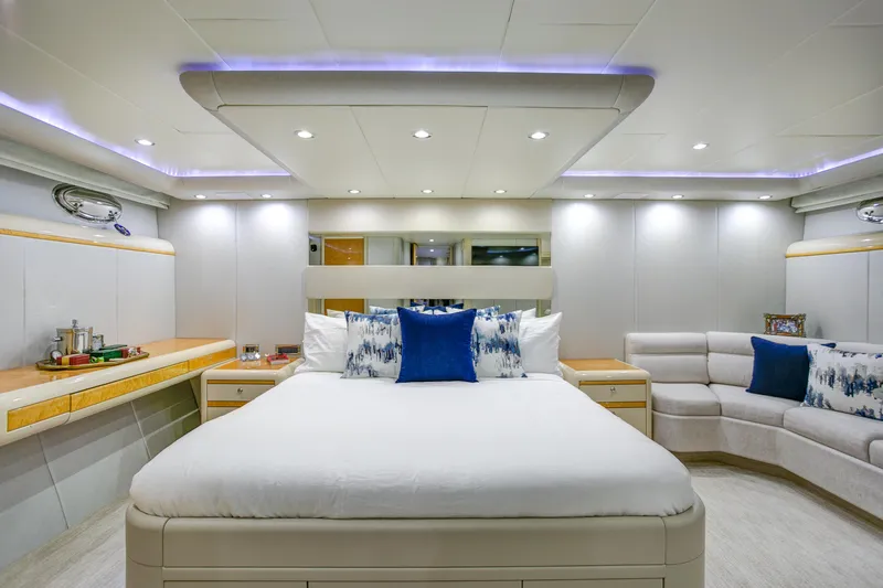 Mautica Yacht Photos Pics Luxurious bedroom interior of 1994 Lazzara 76 yacht with modern design and ambient lighting.