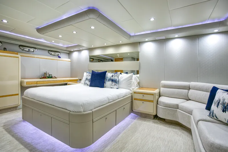 Mautica Yacht Photos Pics Luxurious bedroom interior of 1994 Lazzara 76 yacht with modern lighting and elegant furnishings.